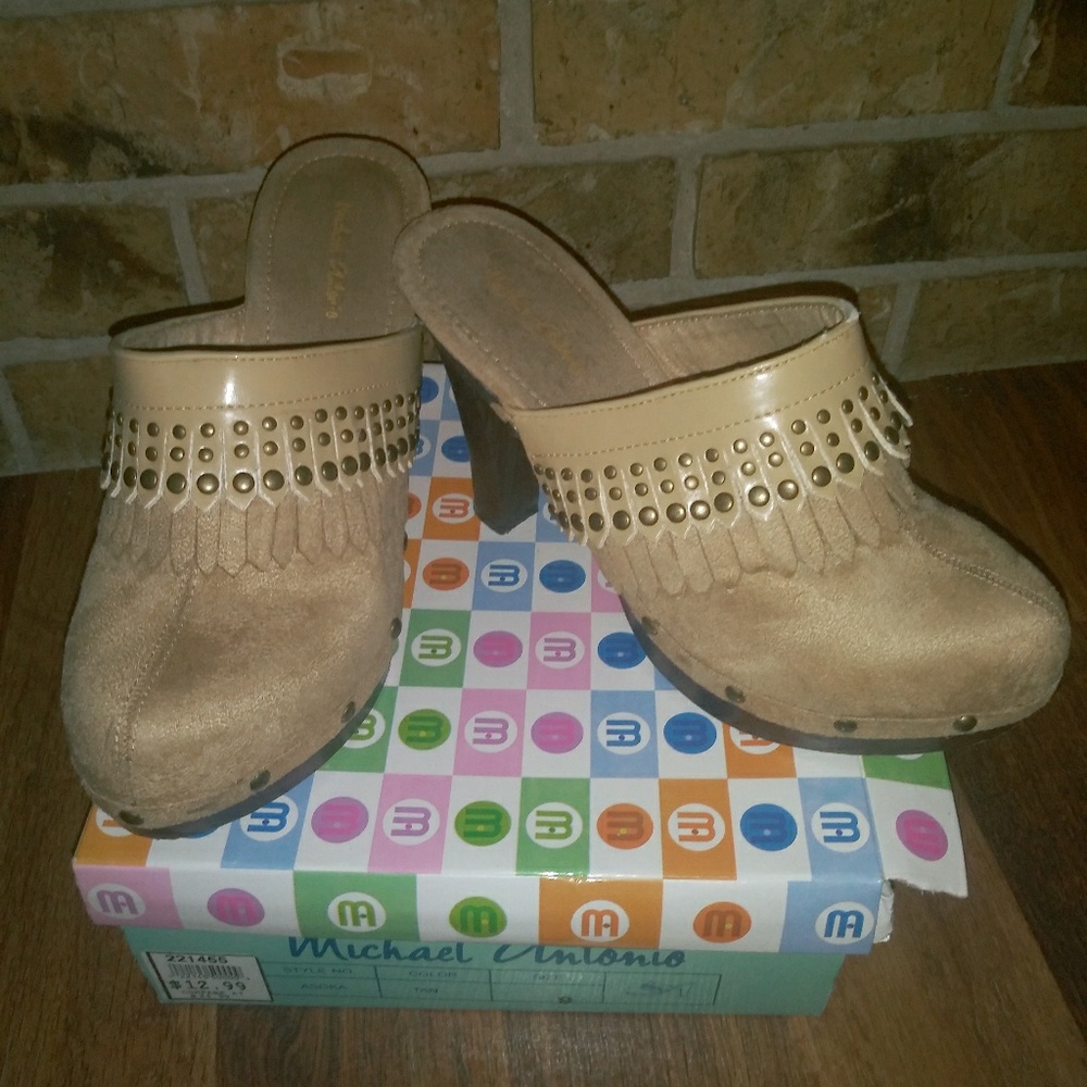 Light brown clogs.